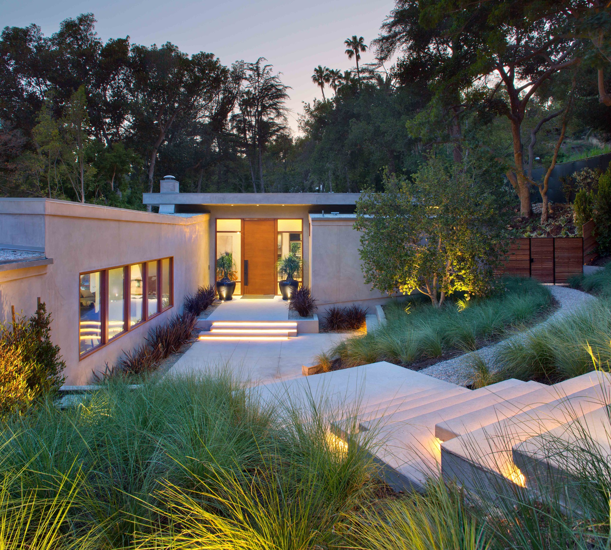 Angelo Project landscaped front entry at dusk